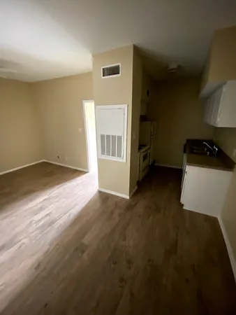 a kitchen with a stove and a refrigerator