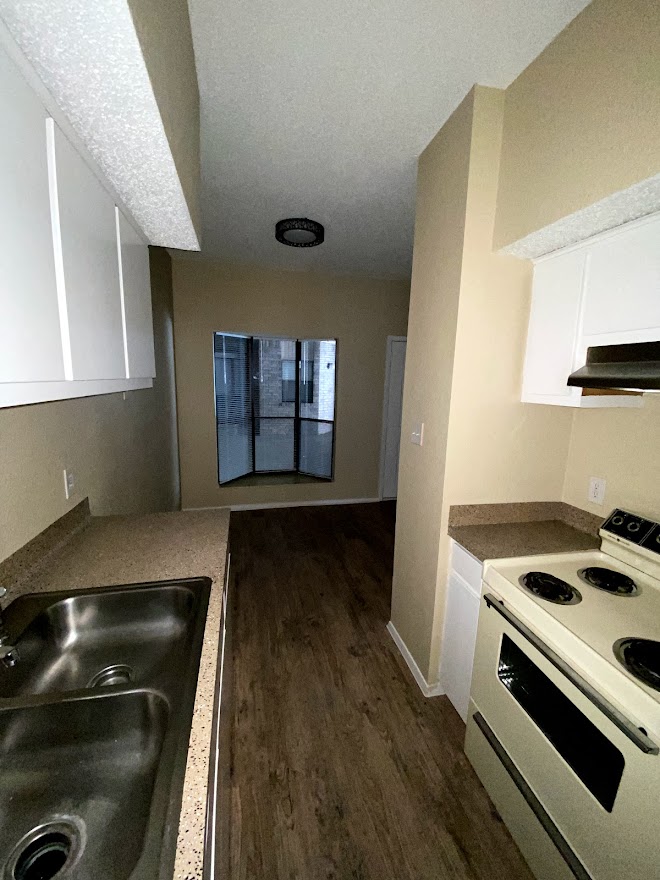 3316 Guadalupe Street, Unit 212 Austin, TX 78705 - Photo 9 of 22 a kitchen with a stove and a refrigerator