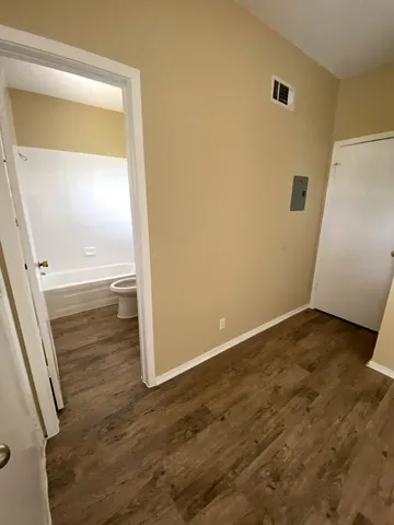 a bathroom with a toilet and a bathtub