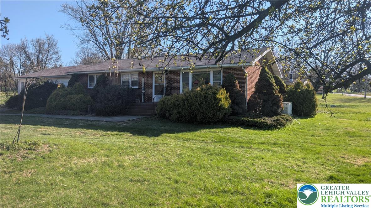 a front view of house with garden