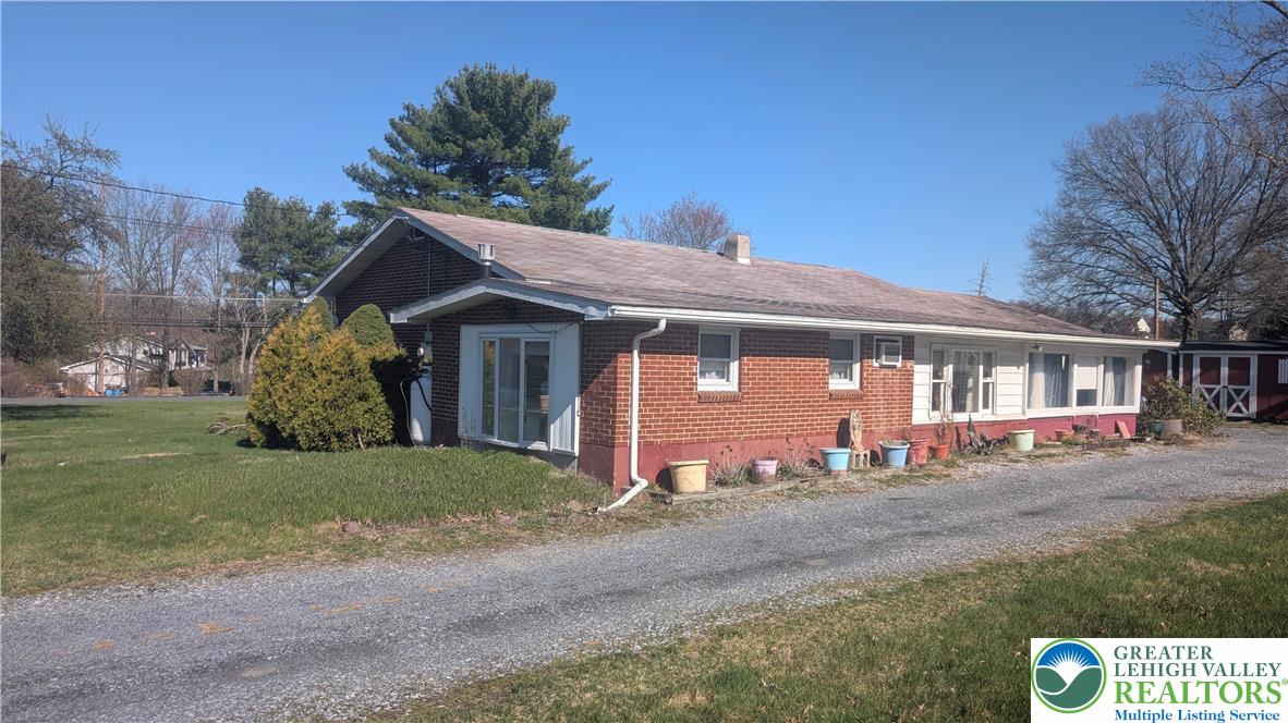 744 South Dogwood Road Walnutport, PA 18088 - Photo 2 of 10 a front view of a house with a garden