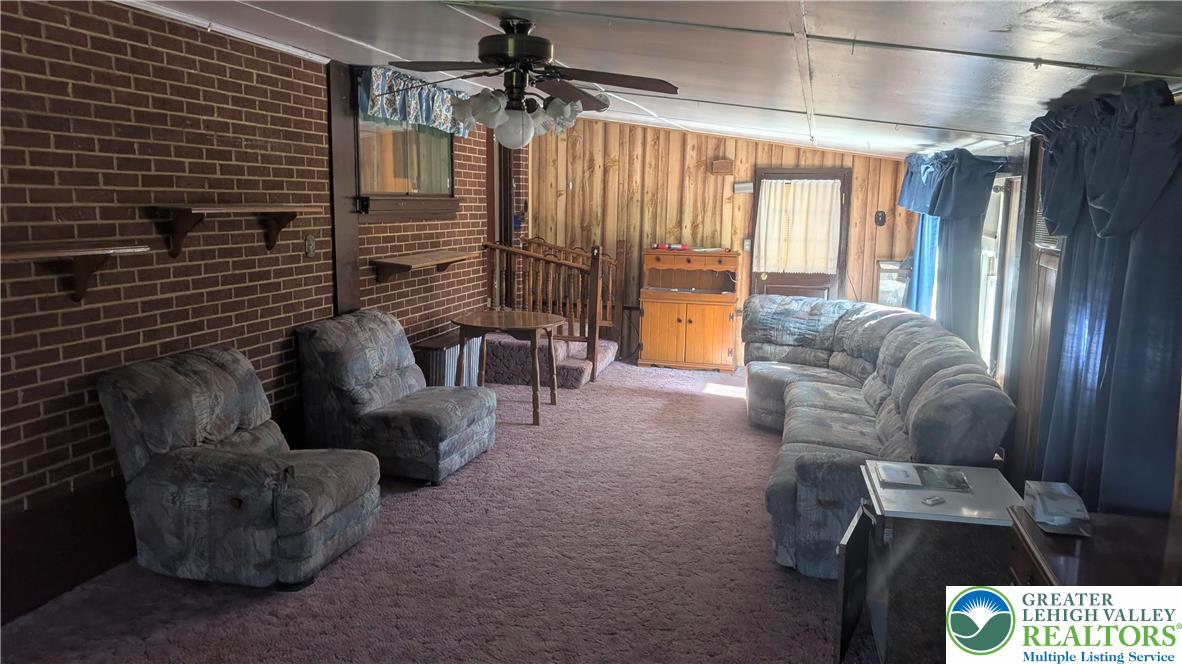 744 South Dogwood Road Walnutport, PA 18088 - Photo 3 of 10 a living room with furniture and a flat screen tv