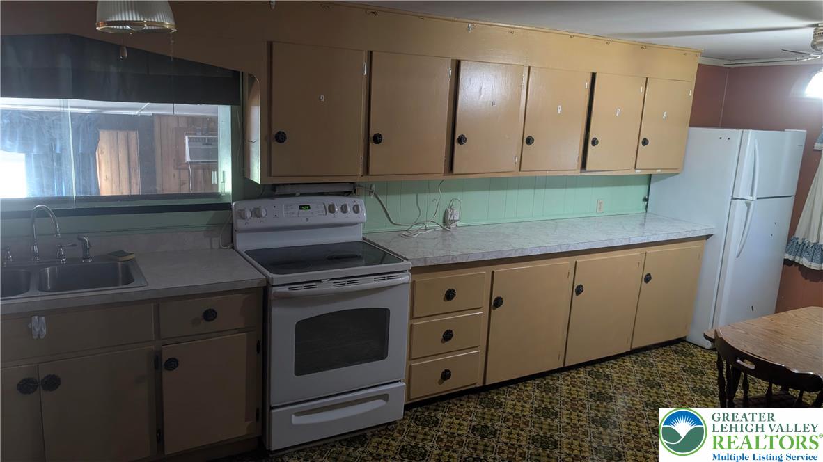 744 South Dogwood Road Walnutport, PA 18088 - Photo 4 of 10 a kitchen with sink cabinets and utility
