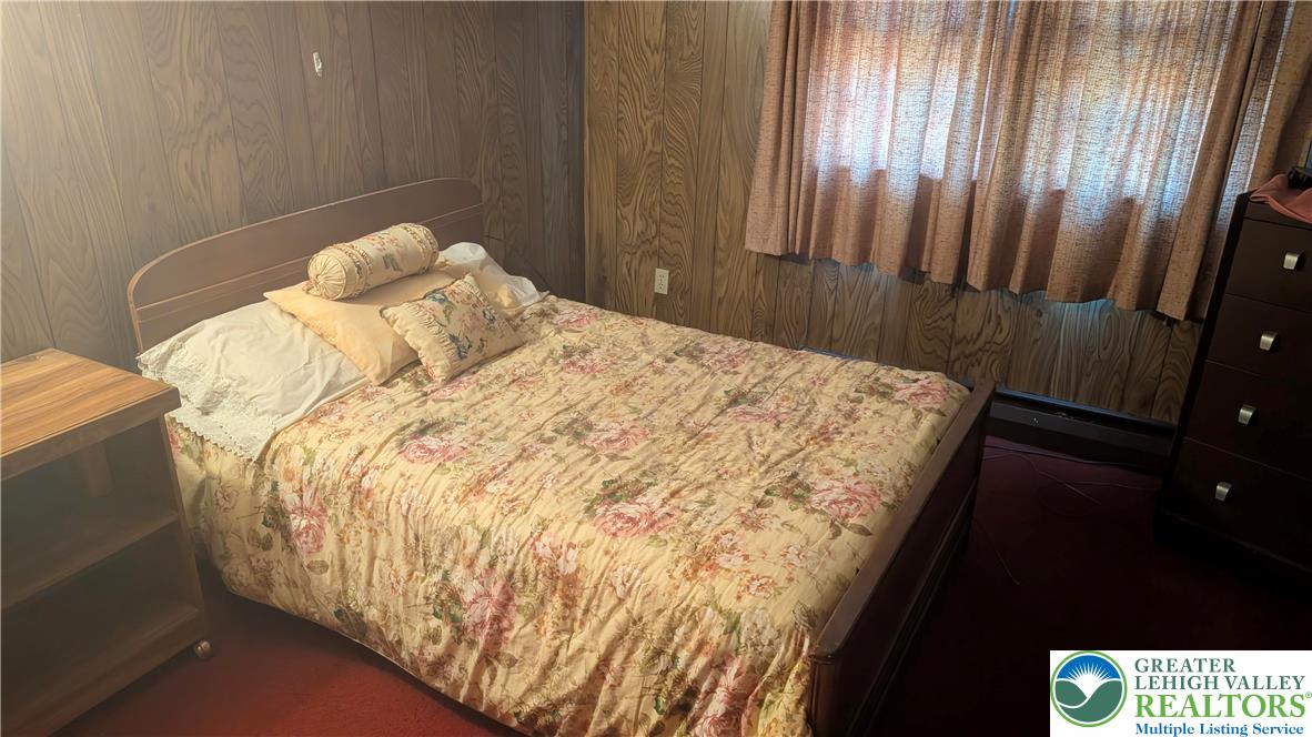 744 South Dogwood Road Walnutport, PA 18088 - Photo 7 of 10 a bed sitting in a bedroom next to a window