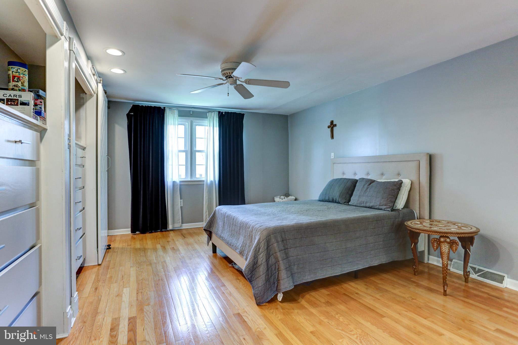 508 Gale Road Camp Hill, PA 17011 - Photo 31 of 50 a bedroom with a large bed chandelier and a window