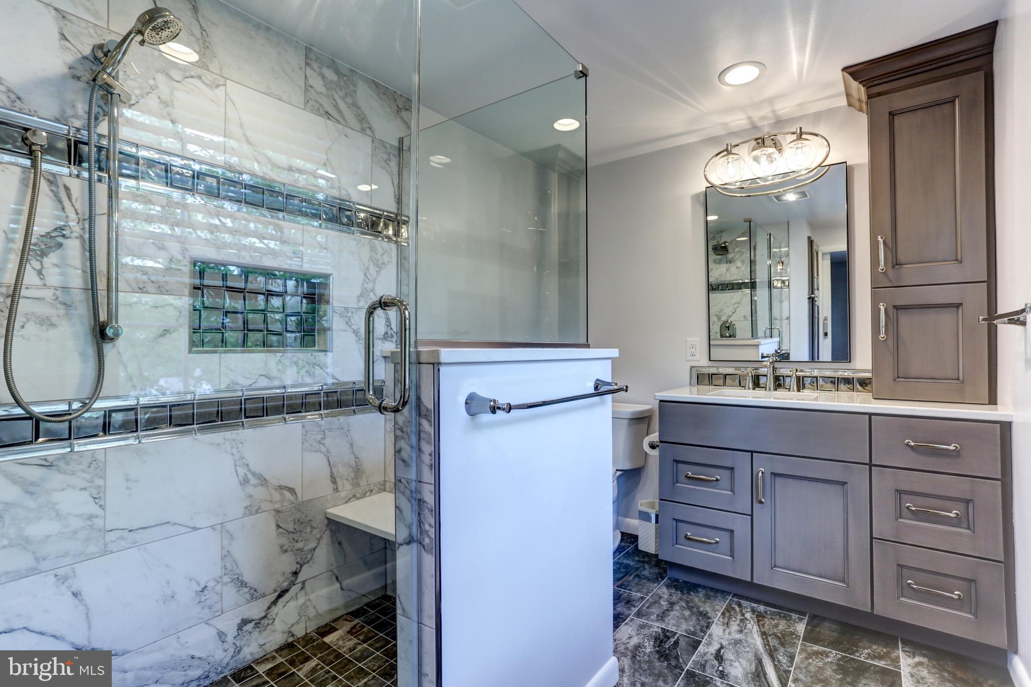 508 Gale Road Camp Hill, PA 17011 - Photo 35 of 50 a bathroom with a double vanity sink a toilet a mirror and shower