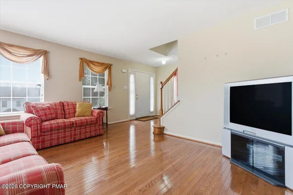 a view of an empty room with stairs
