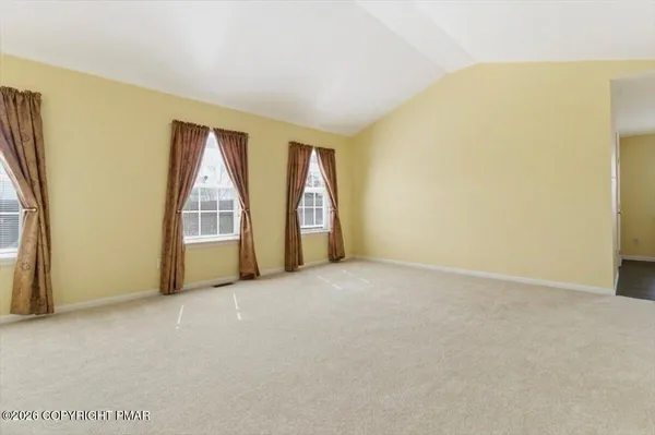 a kitchen with stainless steel appliances granite countertop a sink dishwasher stove and cabinets with wooden floor