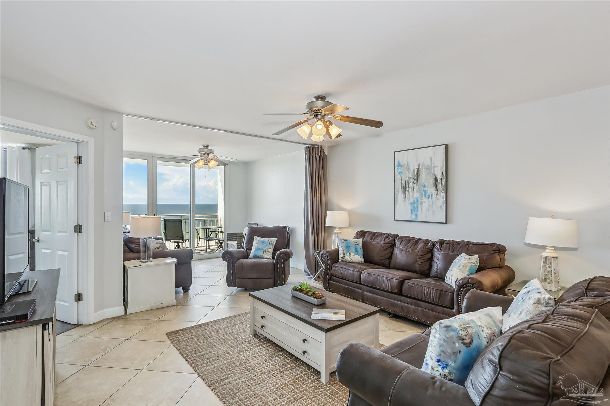 16285 Perdido Key Drive, Unit 424 Pensacola, FL 32507 - Photo 11 of 53 a living room with furniture and a large window