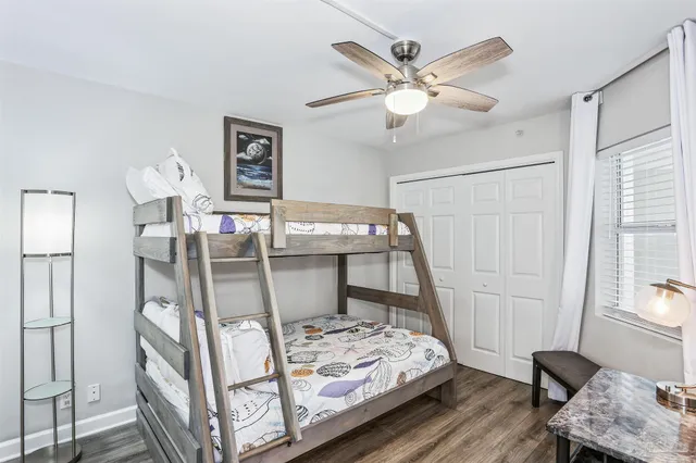 a bedroom with a bed and a table in it