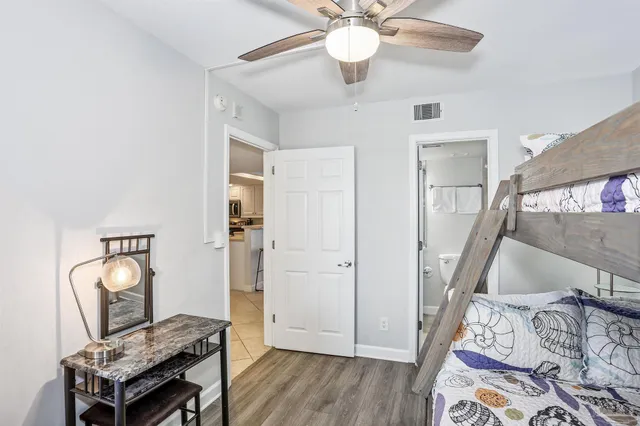 a view of a livingroom with furniture and wooden floor