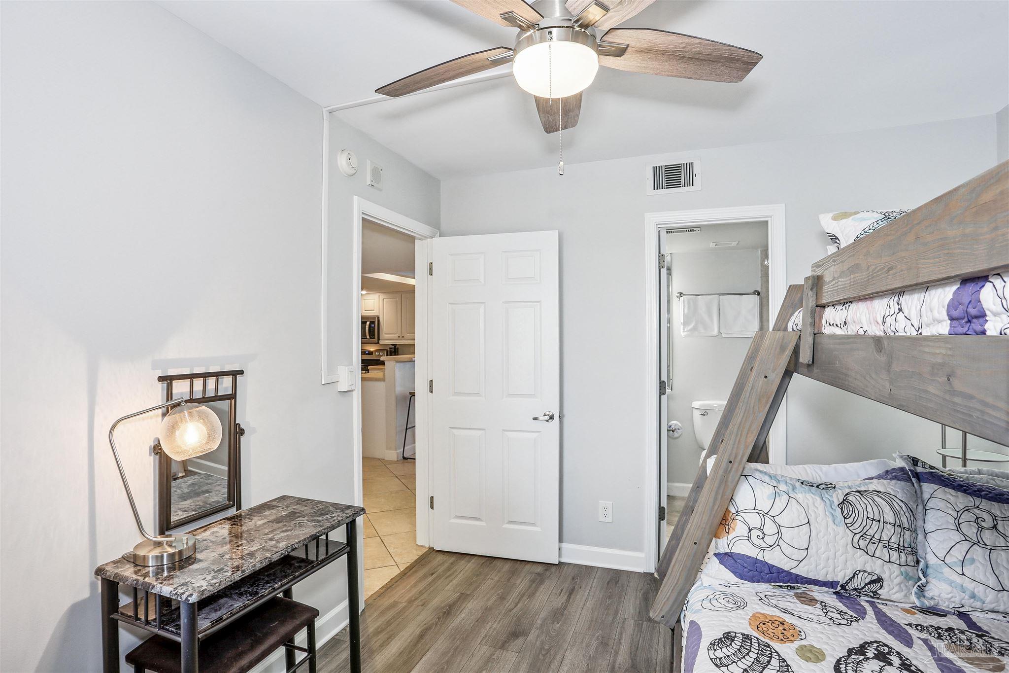 16285 Perdido Key Drive, Unit 424 Pensacola, FL 32507 - Photo 16 of 53 a view of a livingroom with furniture and wooden floor
