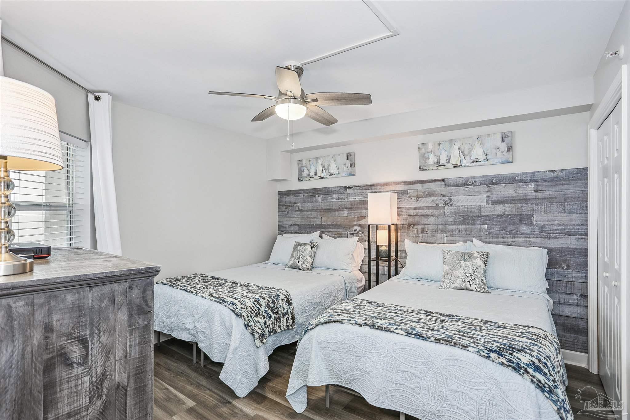 16285 Perdido Key Drive, Unit 424 Pensacola, FL 32507 - Photo 17 of 53 a bedroom with a bed and window