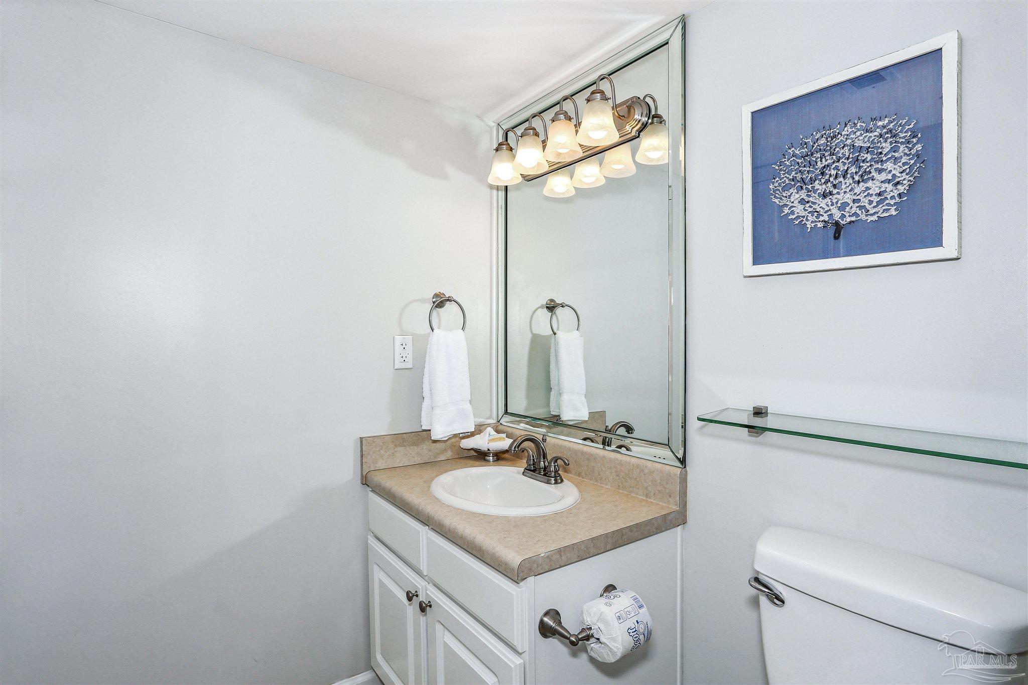 16285 Perdido Key Drive, Unit 424 Pensacola, FL 32507 - Photo 20 of 53 a bathroom with a sink and a mirror