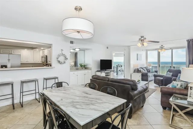 a large kitchen with a table and chairs