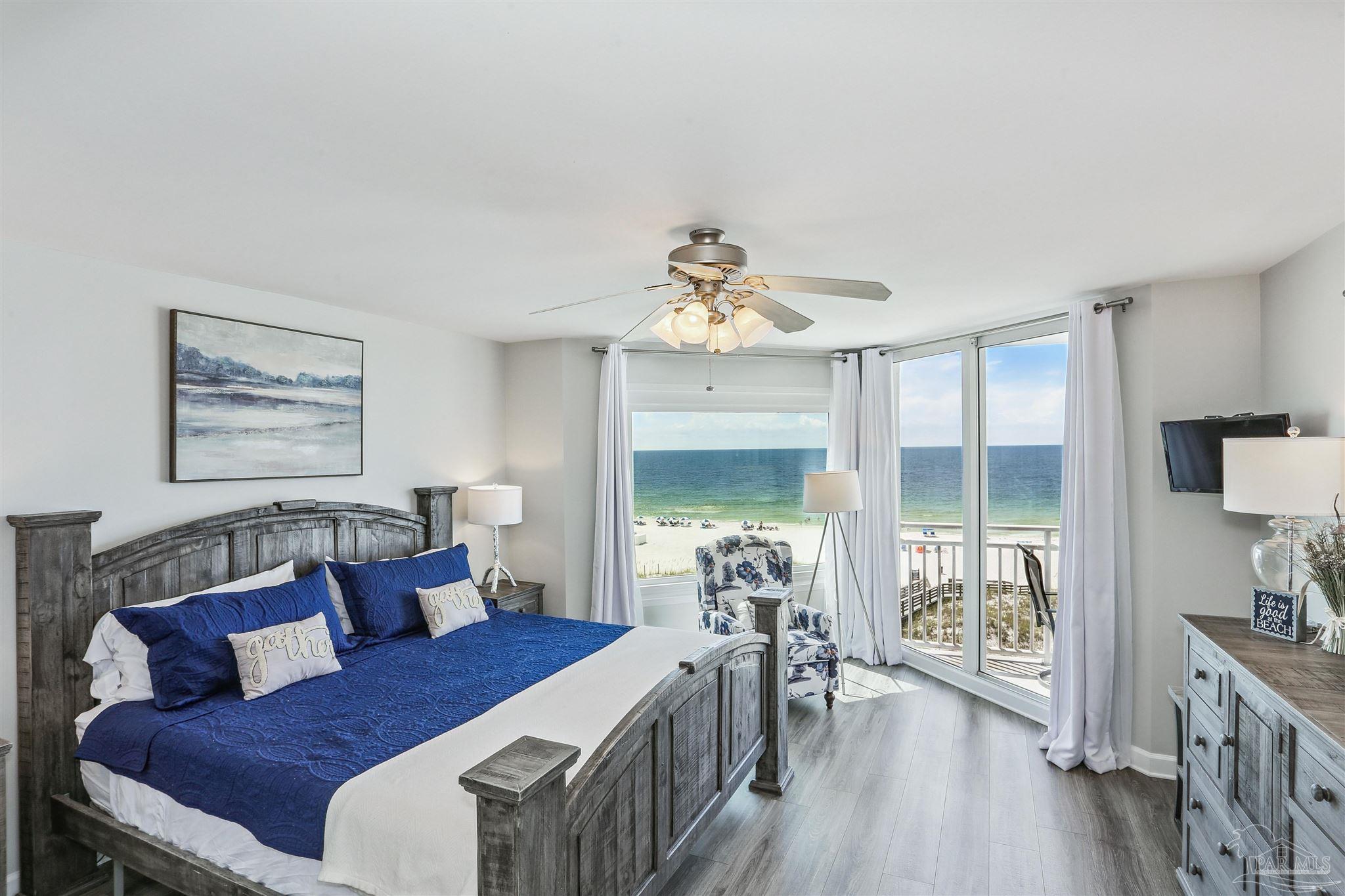 16285 Perdido Key Drive, Unit 424 Pensacola, FL 32507 - Photo 22 of 53 a bedroom with furniture and a large window
