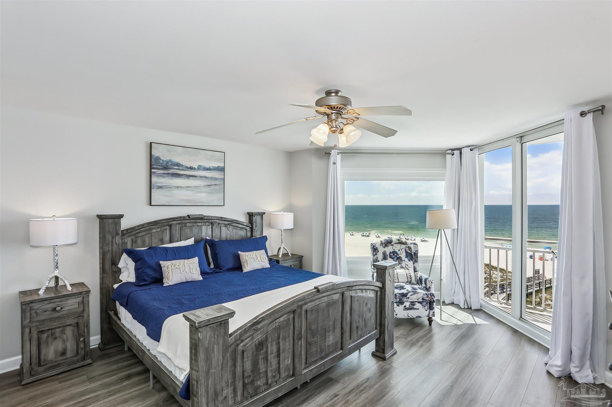 16285 Perdido Key Drive, Unit 424 Pensacola, FL 32507 - Photo 27 of 53 a bedroom with a bed and a table