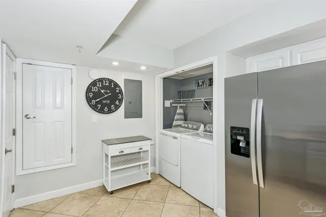 a kitchen with stainless steel appliances a refrigerator and a stove