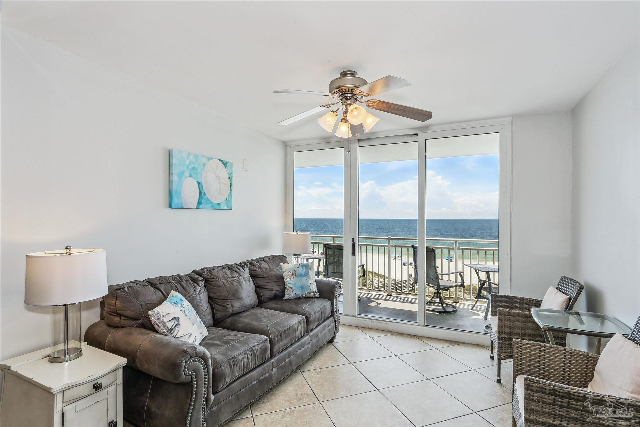 16285 Perdido Key Drive, Unit 424 Pensacola, FL 32507 - Photo 6 of 53 a living room with furniture and a large window
