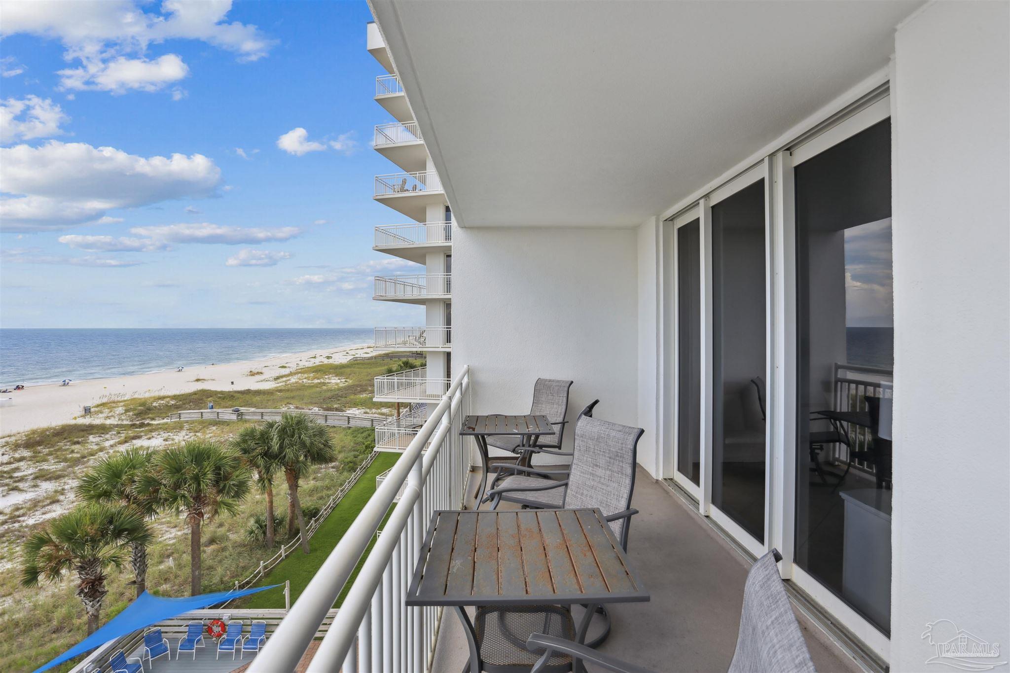 16285 Perdido Key Drive, Unit 424 Pensacola, FL 32507 - Photo 7 of 53 a view of a balcony with chair and table