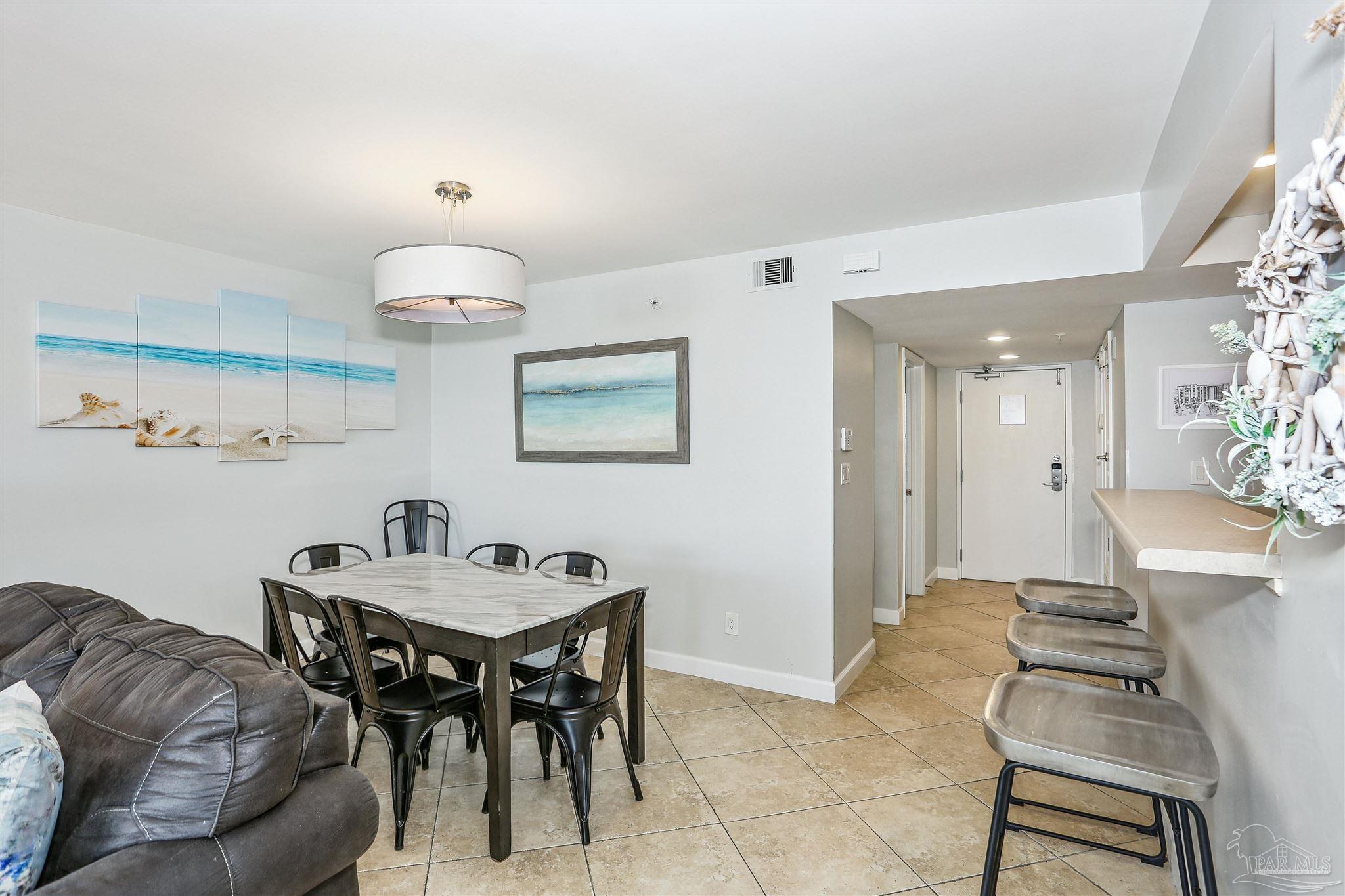 16285 Perdido Key Drive, Unit 424 Pensacola, FL 32507 - Photo 9 of 53 a living room with furniture and a table