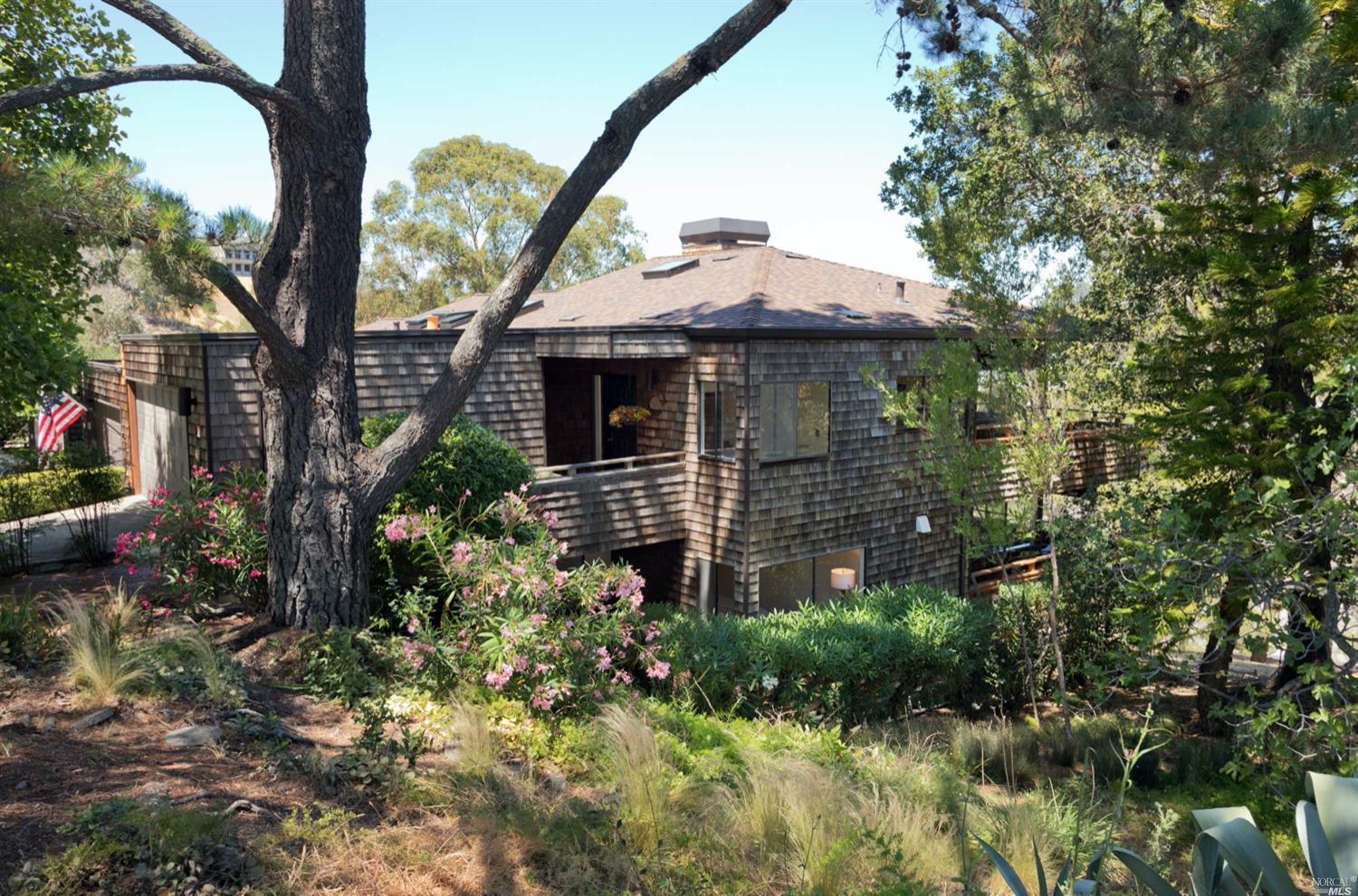 a view of a house with a small yard and plants