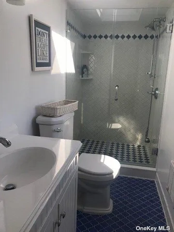 a bathroom with a toilet and a sink