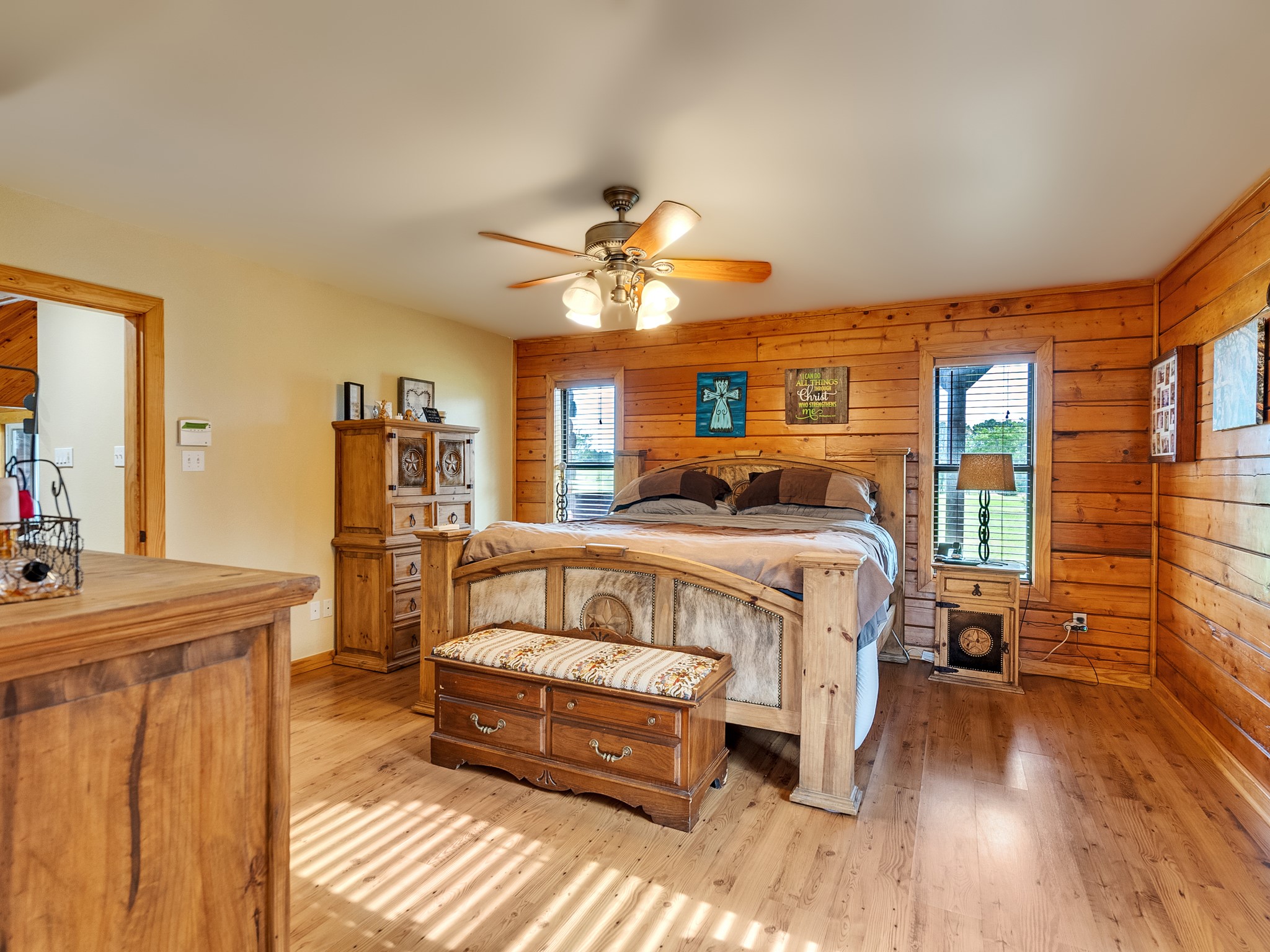 325 Forest Service 217 Road Shepherd, TX 77371 - Photo 35 of 46 a bedroom with a bed and a chandelier