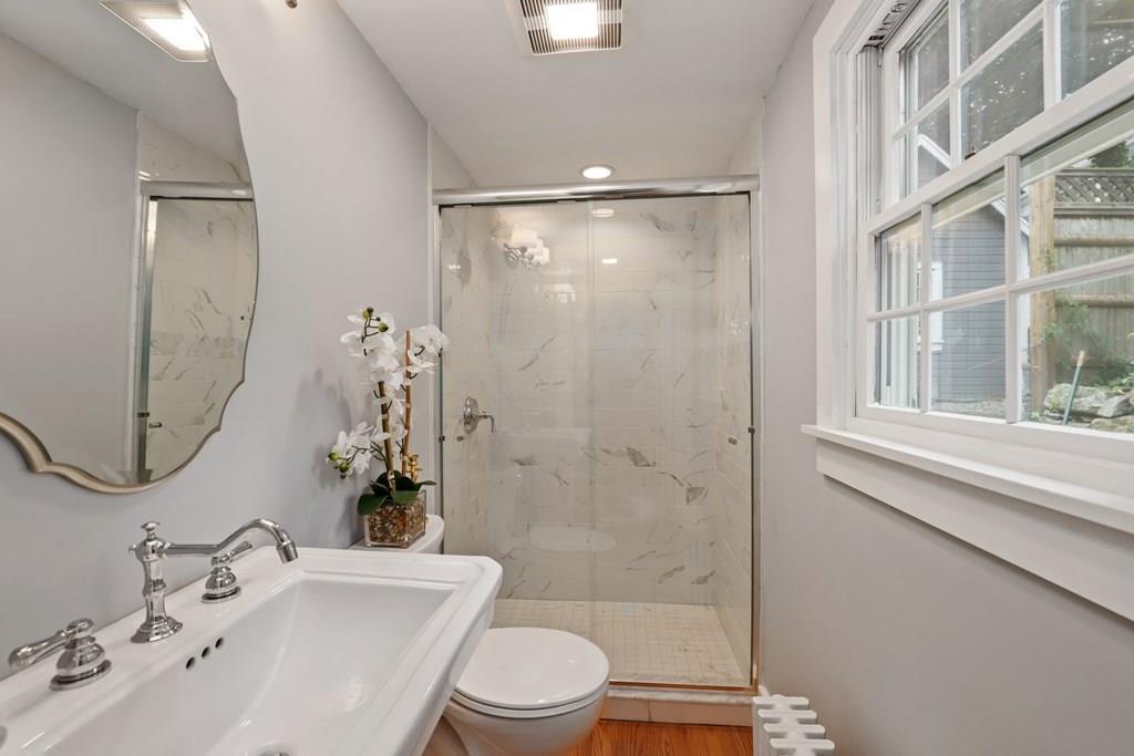434 Main Street Amesbury, MA 01913 - Photo 15 of 40 a bathroom with a sink a toilet and shower