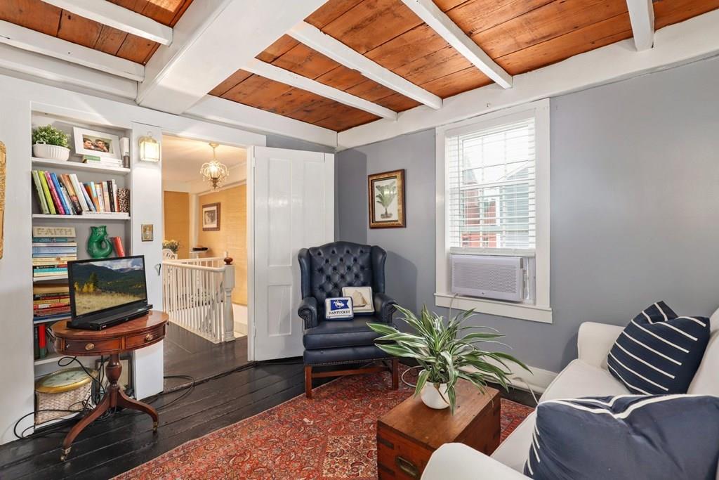 434 Main Street Amesbury, MA 01913 - Photo 24 of 40 a living room with furniture a flat screen tv and a window