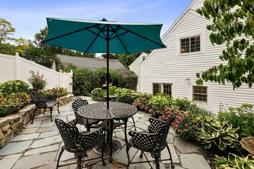 434 Main Street Amesbury, MA 01913 - Photo 29 of 40 a view of a table and chairs under an umbrella