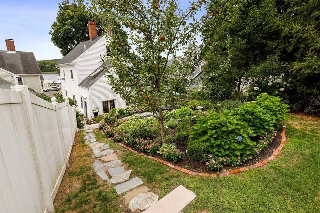 434 Main Street Amesbury, MA 01913 - Photo 33 of 40 a view of a backyard with potted plants