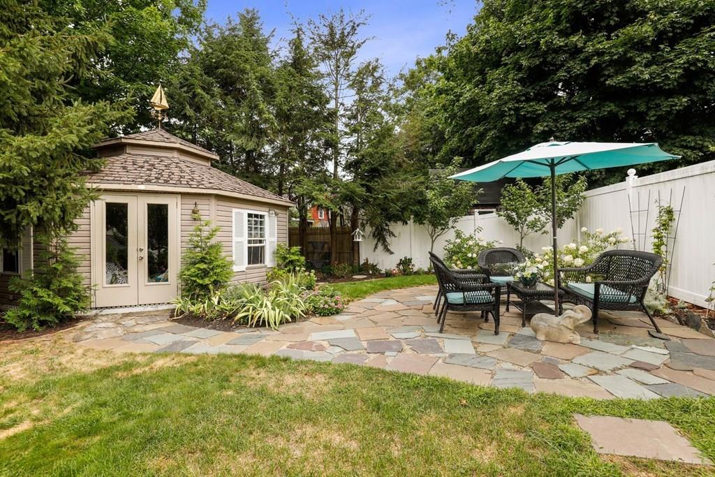 434 Main Street Amesbury, MA 01913 - Photo 37 of 40 a view of a house with backyard sitting area and garden