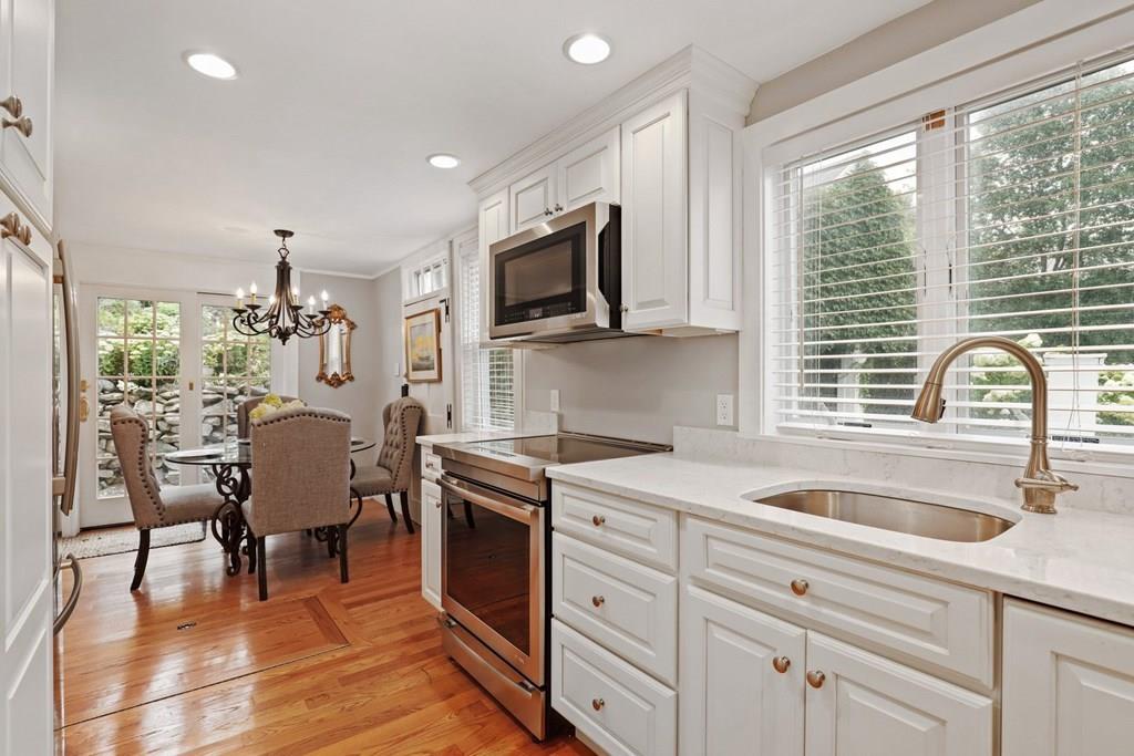 434 Main Street Amesbury, MA 01913 - Photo 6 of 40 a kitchen with a sink cabinets and window