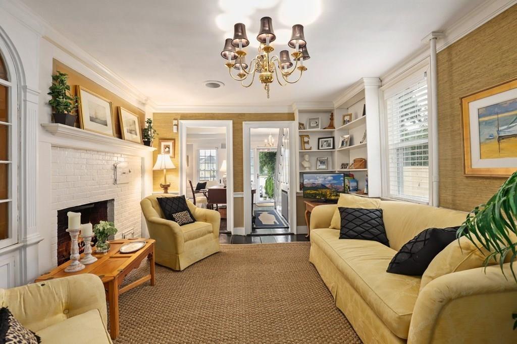 434 Main Street Amesbury, MA 01913 - Photo 8 of 40 a living room with furniture fireplace and a large window