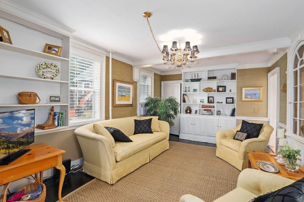 434 Main Street Amesbury, MA 01913 - Photo 9 of 40 a living room with furniture and a chandelier