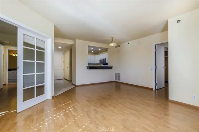 an empty room with a empty space and windows