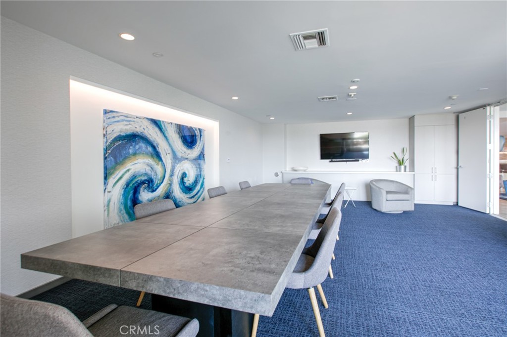 525 East Seaside Way, Unit 704 Long Beach, CA 90802 - Photo 28 of 38 a living room with furniture and flat screen tv