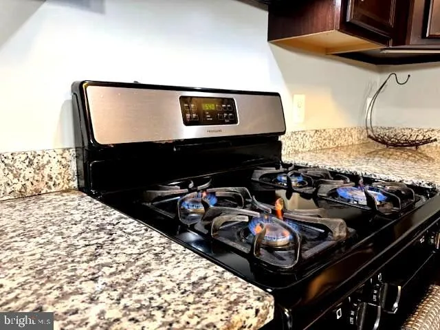 a kitchen with a refrigerator and a sink