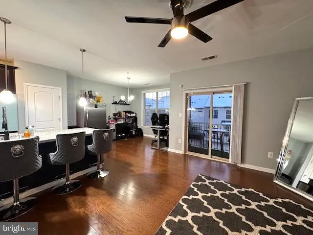 a living room with fireplace furniture and a flat screen tv