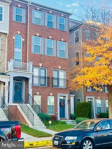a front view of a building with garden and entertaining space