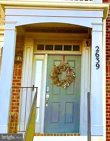 a front view of a house with a large window and door