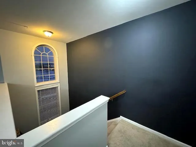 a kitchen with a refrigerator and a sink