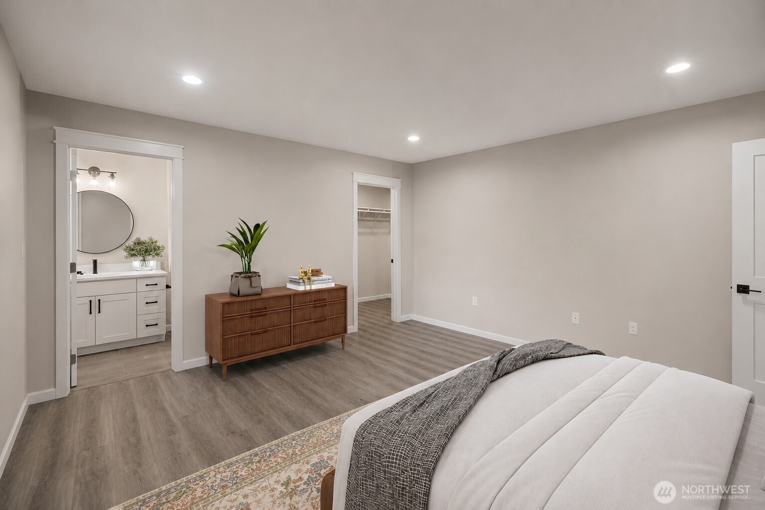 1010 MacFarlane Street Aberdeen, WA 98520 - Photo 12 of 28 a spacious bedroom with a bed and a wooden floor
