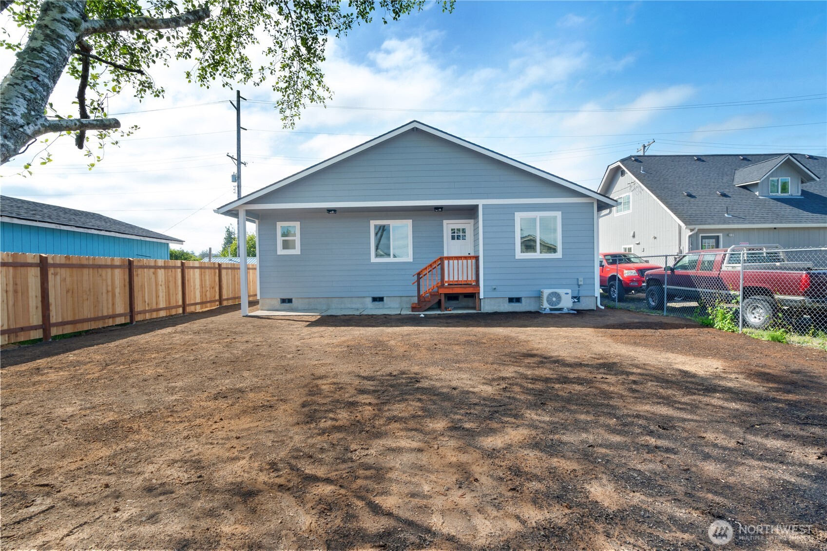 1010 MacFarlane Street Aberdeen, WA 98520 - Photo 19 of 28 a front view of house with yard and trees in the background