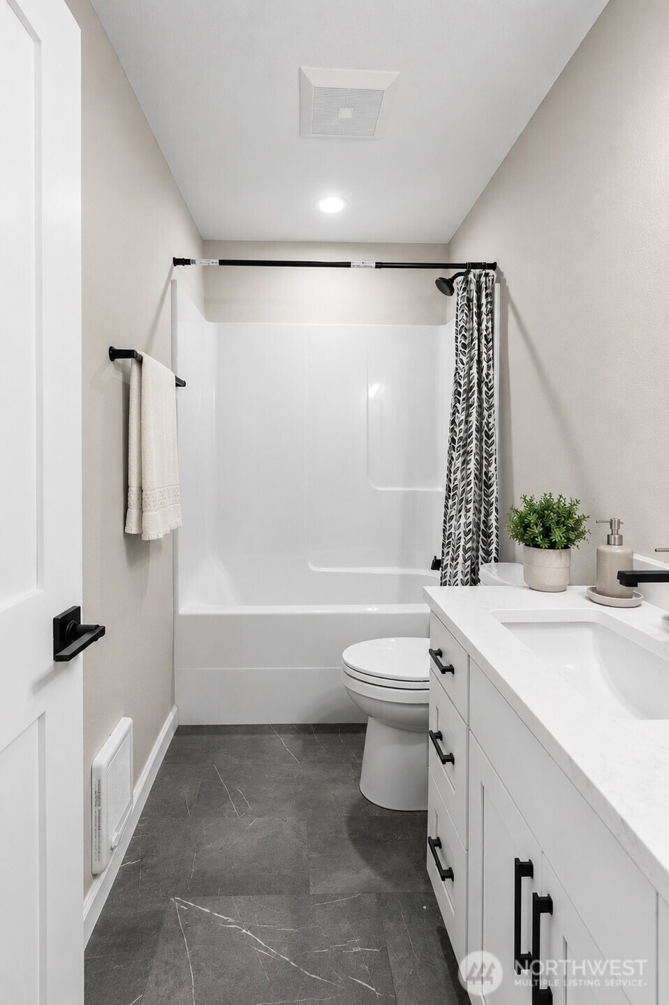 1010 MacFarlane Street Aberdeen, WA 98520 - Photo 8 of 28 a bathroom with a sink a toilet and shower