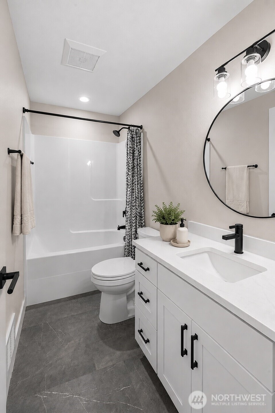 1010 MacFarlane Street Aberdeen, WA 98520 - Photo 9 of 28 a bathroom with a sink a toilet and shower