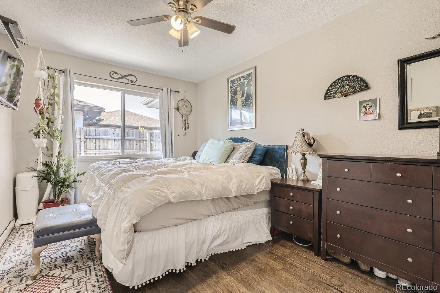 3456 Harrison Street Denver, CO 80205 - Photo 6 of 11 a bedroom with a bed and window
