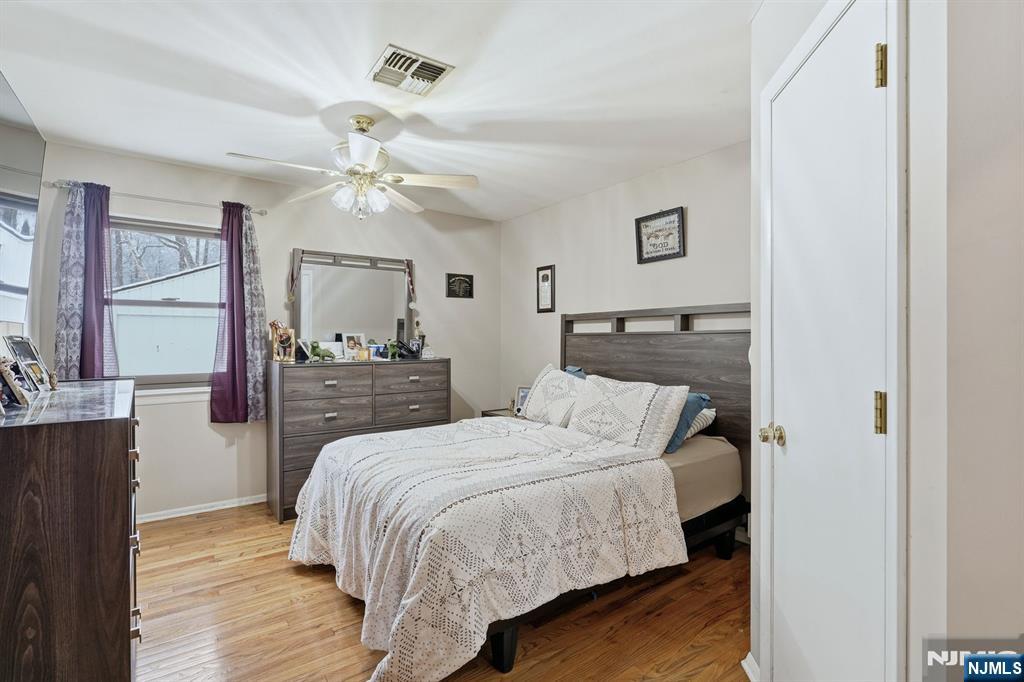 587 Marlboro Road Old Bridge, NJ 08857 - Photo 14 of 36 a bedroom with a bed and a chandelier