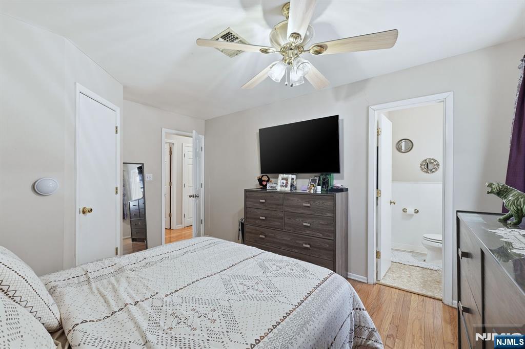 587 Marlboro Road Old Bridge, NJ 08857 - Photo 15 of 36 a bedroom with a bed and a flat tv screen on dresser